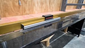 razorgage digitally set material stop on industrial miter saw table ideal machine